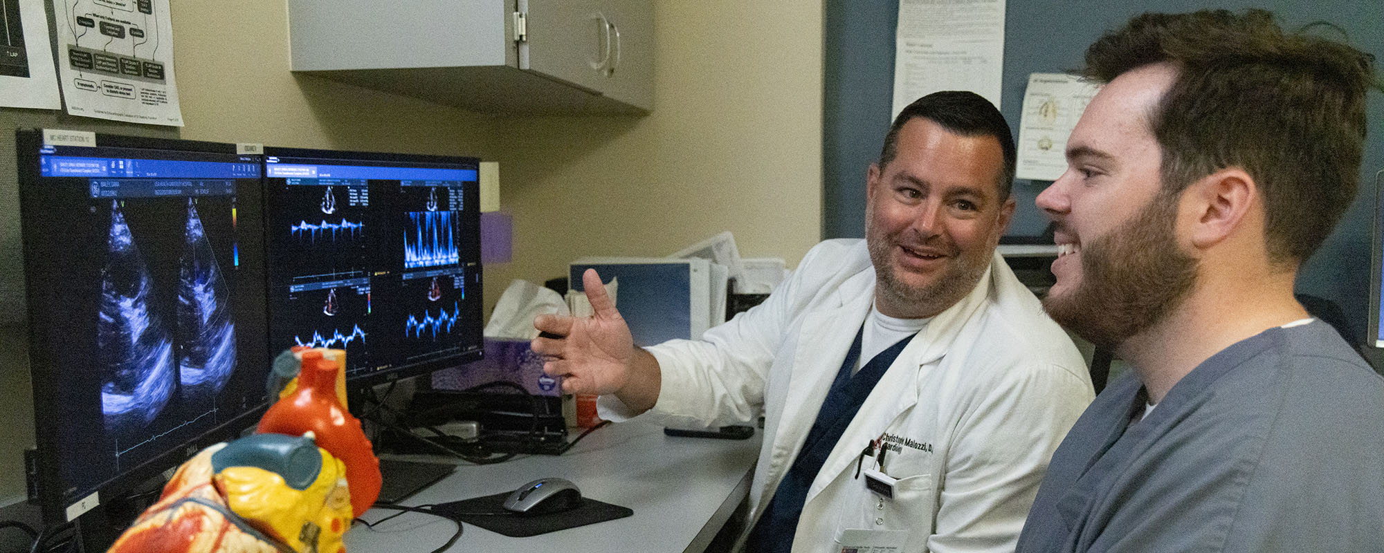 Christopher M. Malozzi, D.O., meets with a medical student from the Whiddon College of Medicine.