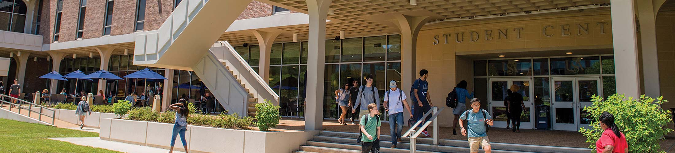Students walking along the outside of the Student Center.
