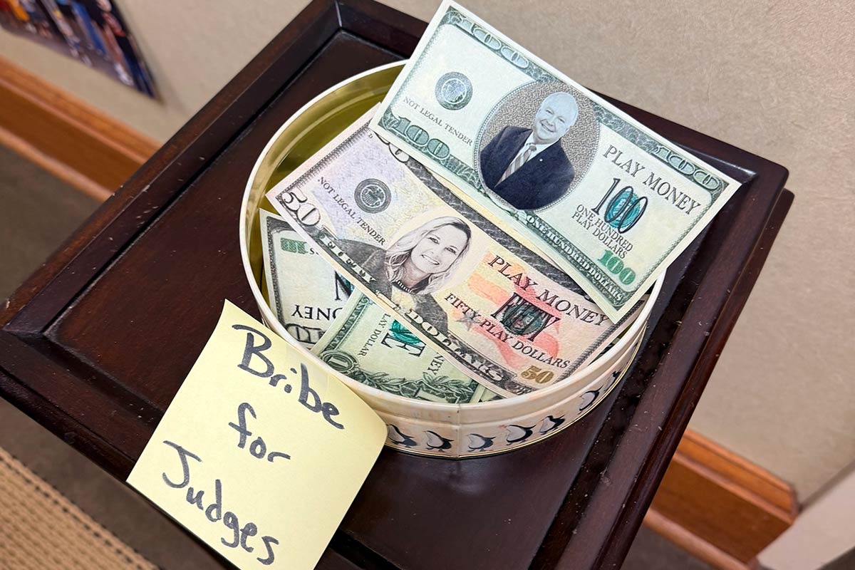 Bribes for Judges with fake money with President Bonner and Dr. Kent on them.